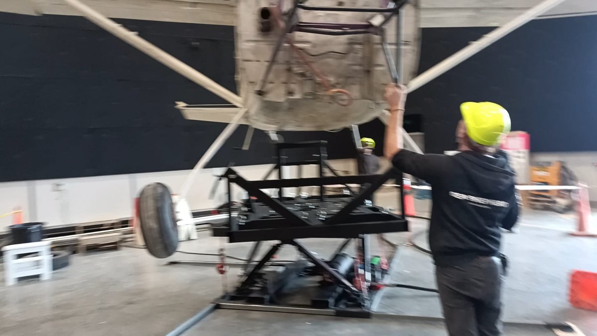 Mounting a Cessna 182 aircraft onto a custom frame for use on a motion base.