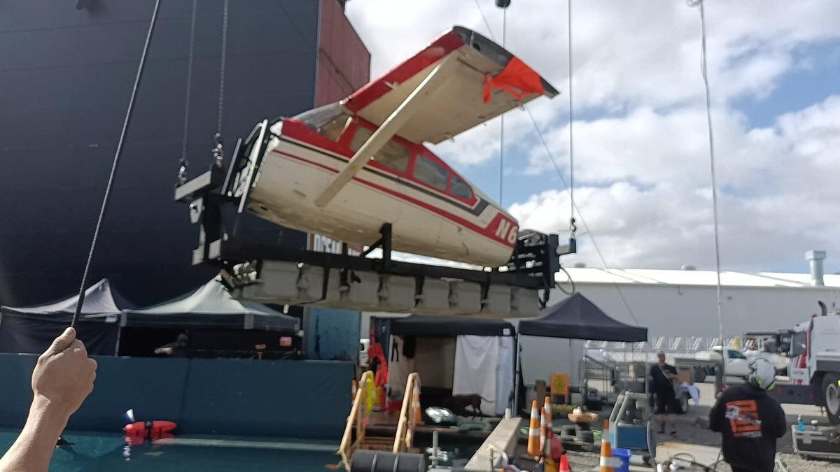 Custom hydraulic rotation system lifting a Cessna 182 aircraft.